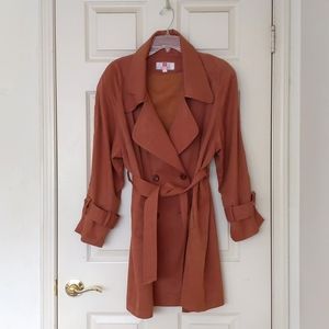 Lightweight Trench Coat with Double Breasted, Full Lining, Pockets and Belt.